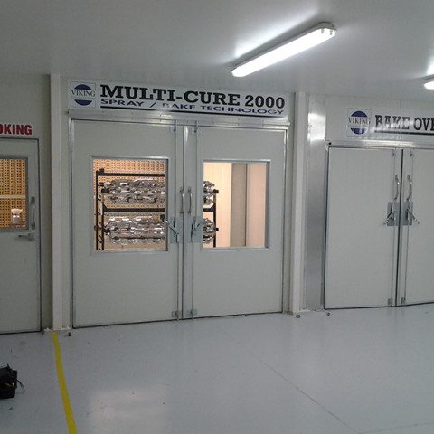 Purpose built production booths. Dual operators, heated spray booths. Internal access to curing oven with 80&deg;C for vacuum metallization process. Shoplands, Auckland.